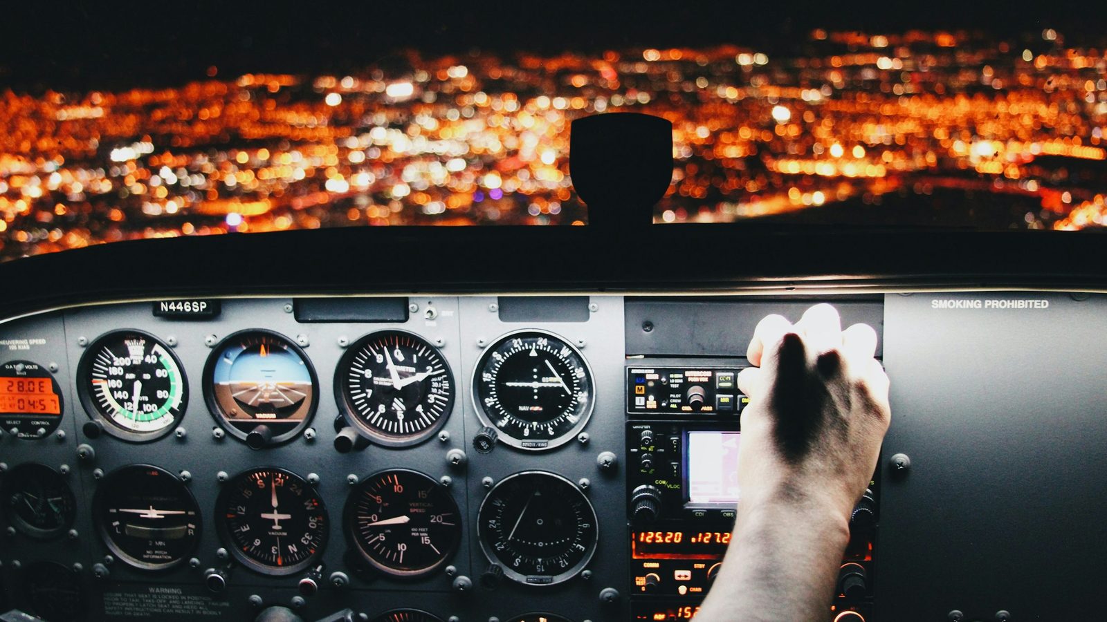 Pilot planning materials with controls, charts, and cockpit instrumentation.