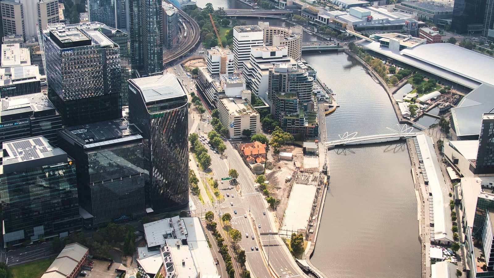 Aerial river and city corridor view used for route and airspace training context.